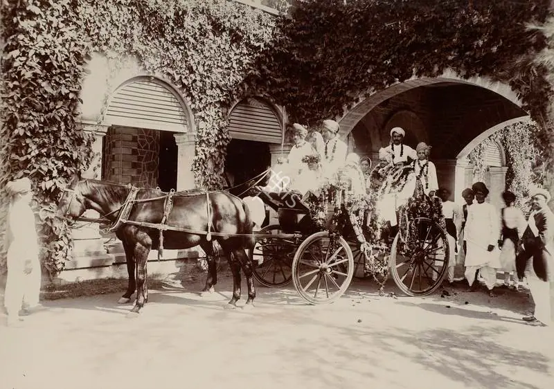 Studio Bourne & Shepherd (Photographic Studio). Floral Presentation at the Torchlight Procession - From the album 'Shri Bhagvatsinhji Silver Jubilee Memorial Album. Gondal A.D. 1909 by Bourne & Shepherd'. Silver gelatin print pasted on mount, 1909 | Antiquarian Photograph | Photography | 00115361