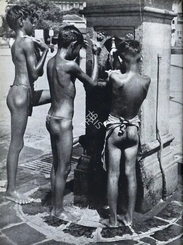 Bacha, Major R. A. (Photographer). Three Urchins Take an Open-Air Bath on Apollo Bunder and are Captured for Posperity, n.d. | Contemporary Photograph