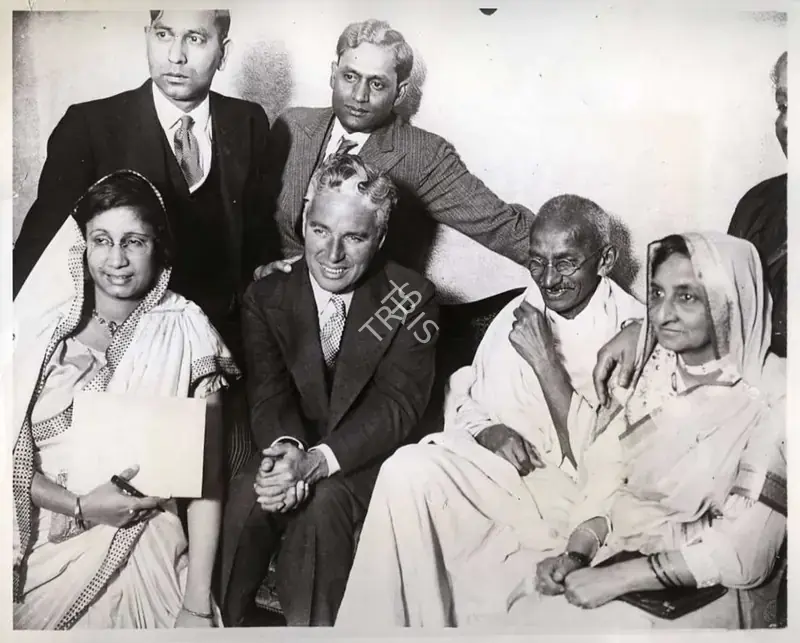 Unknown (Photographer). Charlie Chaplin and Mahatma Gandhi - This photograph shows Chaplin and Gandhi  together at Dr. Katial's residence. Renowned Indian artist Somnath Khosa turned this phtoograph into a painting, 22 September 1931 | Photographic Still | CinemaEducation | 00440369