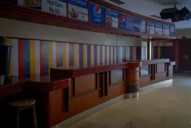 Chaturvedi, Hemant (Photographer). Food counter of Regal Cinema, Mumbai, India, c. 2019-2024 | Contemporary Photograph