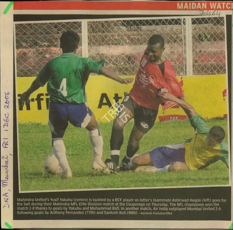 Kamlesh Pednekar (Reporter), Mahindra United's Yusif Yakubu (centre) is Tackled by a RCF Player as Latter's Teammate Ashirwad Hegde (left) goes for the ball during their Mahindra MFL Elite Division match at the Cooperage on Thursday, 2006, Newspaper Clipping
