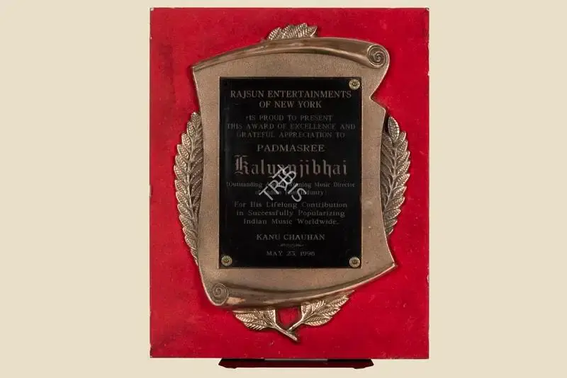 Unknown (Artist), Unknown (Artist), Award Presented by Rajsun Entertainers of New York to Padmasree Kalyanjibhai for his Lifelong Contribution in Successfully Popularizing Indian Music Worldwide on May 23, 1998 | Jubilee Trophy, 23 May 1998, Jubilee Trophy