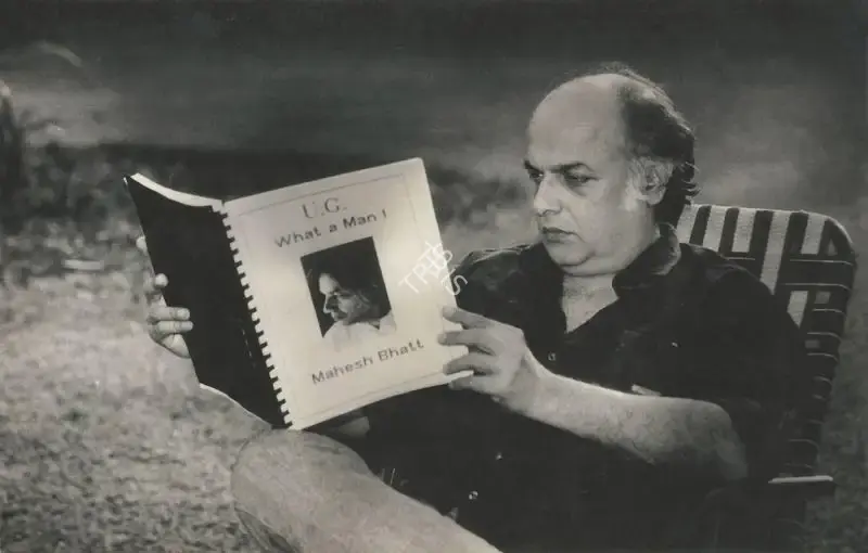 Unknown (Photographer). Mahesh Bhatt holding a copy of U.G.: What A Man!. | Photographic Still | Photography | 00840310