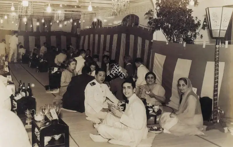 Unknown (Photographer). A Japanese dinner aboard the SS Asama Maru, America bound. A Purser with Bapsy, her friend Piroja and Jehangir. Photographic Still, 1939 | Contemporary Photograph, The Crucible of Painting, 2005 | Photography | 00801901