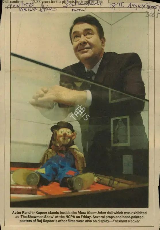 Prashant Nadkar (Photographer), Actor Randhir Kapoor Stands beside the Mera Naam Joker Doll which was Exhibited at 'The Showman Show' at the NCPA on Friday. Several Props and Hand-painted Posters of Raj Kapoor's other Films were also on Dlsplay, 2007, Newspaper Clipping