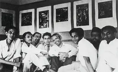 Unknown (Photographer). At Raza's solo exhibition on Kashmir Series, Bombay Art Society Salon, 1948. S.H. Raza with F.N. Souza, H.A. Gade, V.S. Gaitonde, K.H. Ara, Abbasi, M.F. Husain and Tyeb Mehta. Photographic Still, 1948 | Contemporary Photograph, Sayed Haider Raza, 2023 | Photography | 00892765