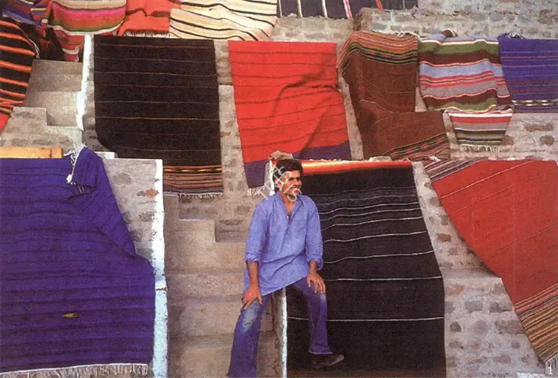 Unknown (Photographer), Vivan Sundaram Amidst Durries Woven at Pit-Loom in Ivy Lodge, Kasauli, 1980, Contemporary Photograph