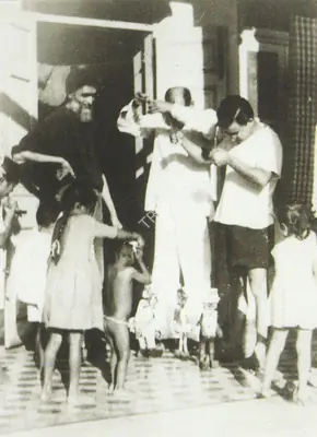 Unknown (Photographer), With children during an informal puppet session, M. F. Husain is in the background, Contemporary Photograph