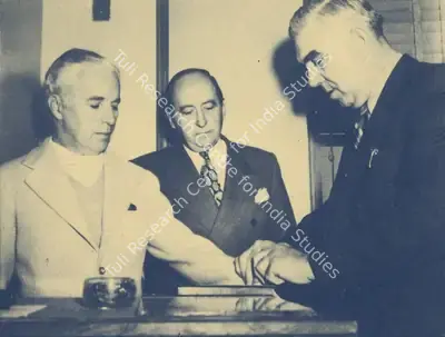 Unknown (Photographer). Charlie Chaplin - Chaplin's fingerprints being taken at a police station in the wake of the controversy regarding his communist ties | Photographic Still, My Life in Pictures, 1985 | CinemaEducation | 00440372