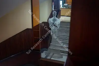 Hemant Chaturvedi (Photographer), The famous Oscar trophy etched on a mirror panel leading up to the balcony of Regal Cinema, Mumbai, India, 2024, Contemporary Photograph