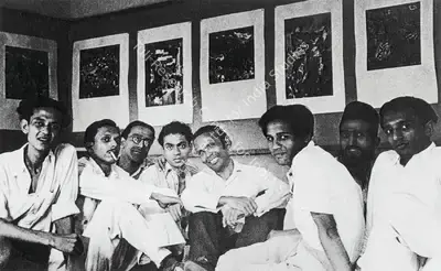 Unknown (Photographer). At Raza's solo exhibition on Kashmir Series, Bombay Art Society Salon, 1948. S.H. Raza with F.N. Souza, H.A. Gade, V.S. Gaitonde, K.H. Ara, Abbasi, M.F. Husain and Tyeb Mehta. Photographic Still, 1948 | Contemporary Photograph, Sayed Haider Raza, 2023 | Photography | 00892765
