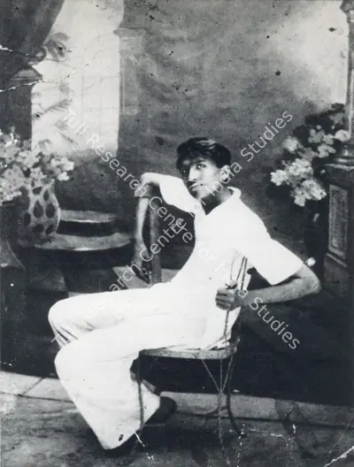 (Photographer). Husain as a teenager, photographed against a backdrop he painted. Photographic Still, 1934 | Contemporary Photograph, Maqbool Fida Husain, 1971 | Photography | 00501645
