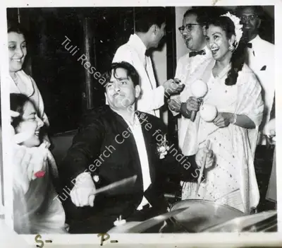 Unknown (Photographer). Raj Kapoor and his love for music. | Photographic Still | CinemaEducation | 00749411