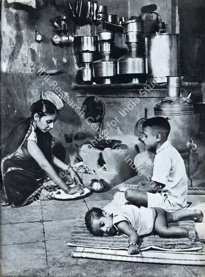 Major R. A. Bacha (Photographer), A Mill Labourer's Wife Prepares a Meal with Her Children by Her Side, Contemporary Photograph