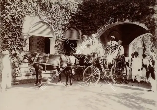 Studio Bourne & Shepherd (Photographic Studio). Floral Presentation at the Torchlight Procession - From the album 'Shri Bhagvatsinhji Silver Jubilee Memorial Album. Gondal A.D. 1909 by Bourne & Shepherd'. Silver gelatin print pasted on mount, 1909 | Antiquarian Photograph | Photography | 00115361