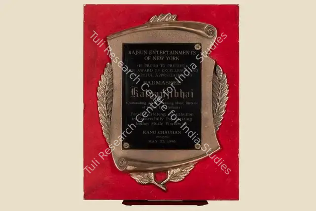 Unknown (Artist), Award Presented by Rajsun Entertainers of New York to Padmasree Kalyanjibhai for his Lifelong Contribution in Successfully Popularizing Indian Music Worldwide on May 23, 1998 | Jubilee Trophy, 23 May 1998 | CinemaEducation | 00842283
