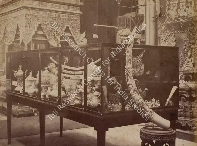 Narayan, Shew Shankar (Photographer). Carved Tusk and Repousse Silver Work - Burmese Court - From the album 'Calcutta International 1883-84 Exhibition Views'. Albumen print pasted on mount, 1883-1884 | Antiquarian Photograph | Photography | 00115301
