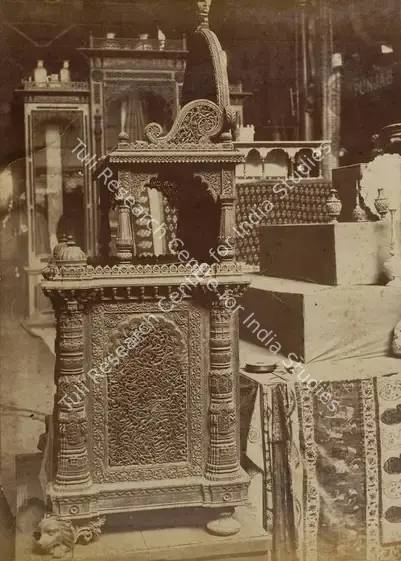 Narayan, Shew Shankar (Photographer). Ahmedabad Cabinet in Carved Wood with Designs copied from Ancient Mosques - Bombay Court - Side View - From the album 'Calcutta International 1883-84 Exhibition Views'. Albumen print pasted on mount, 1883-1884 | Antiquarian Photograph | Photography | 00115294