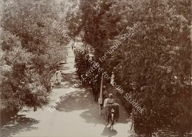 Studio Bourne & Shepherd (Photographic Studio). Procession entering His Highness's residence. The Troops - From the album 'Shri Bhagvatsinhji Silver Jubilee Memorial Album. Gondal A.D. 1909 by Bourne & Shepherd'. Silver gelatin print pasted on mount, 1909 | Antiquarian Photograph | Photography | 00115348