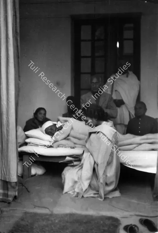 Cartier-Bresson, Henri (Photographer), Gandhiji lying on his bed on the fifth day of his fast as Dr.Sushila Nayar reads him a letter Birla House 17 January 1948, 1948 | Contemporary Photograph | Photography | 00113021