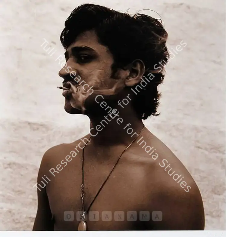 Waswo, Waswo X. (Artist). My Assistant Smokes A Beedi - Hampi. Sepia toned silver gelatine print on paper, 2002 | Print | FineArts | 0023656